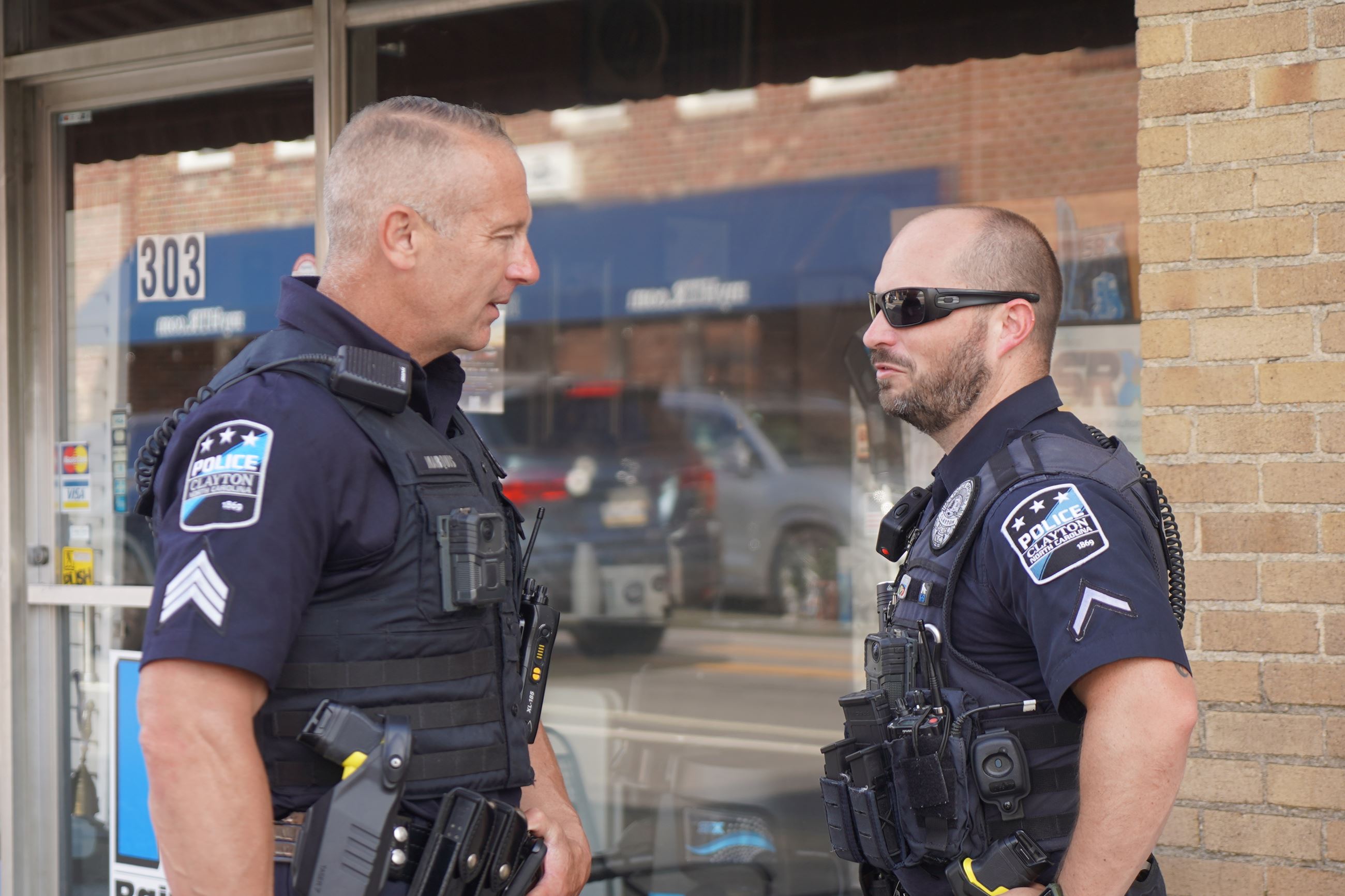 Clayton Police Officers on Patrol along Downtown Street