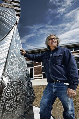 Hanna Jubran with one of his sculptures