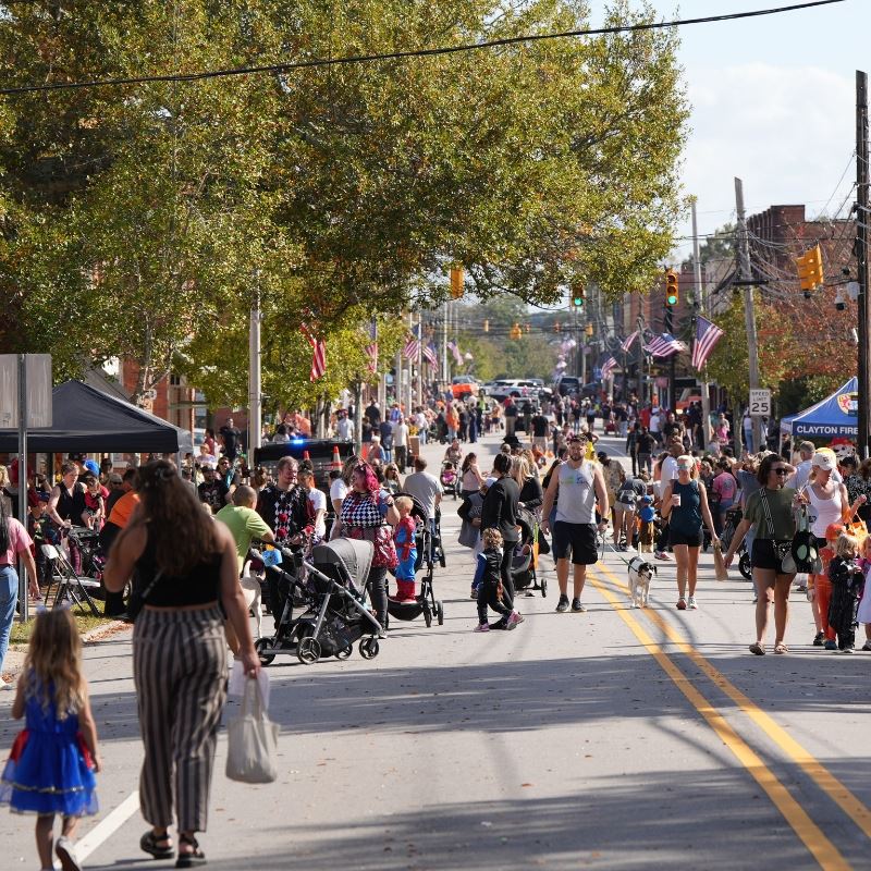 Large crowd walks Main Street in Halloween costumes